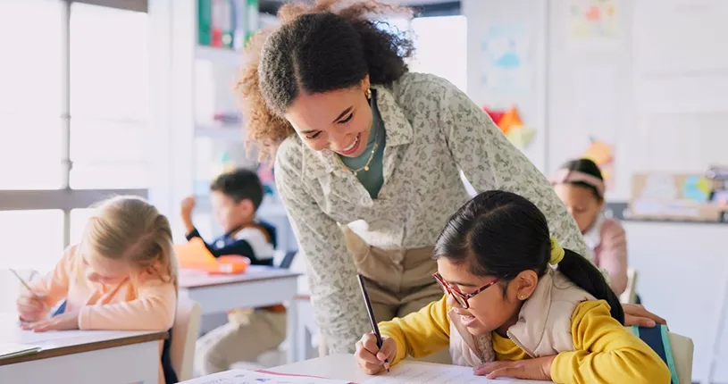 A female teacher helping a student