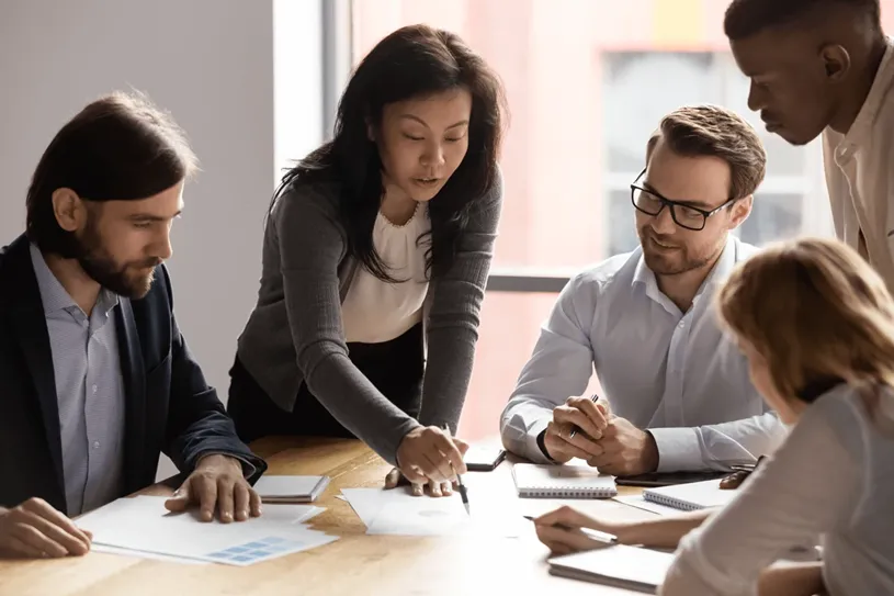 Group of educators in discussion at a table