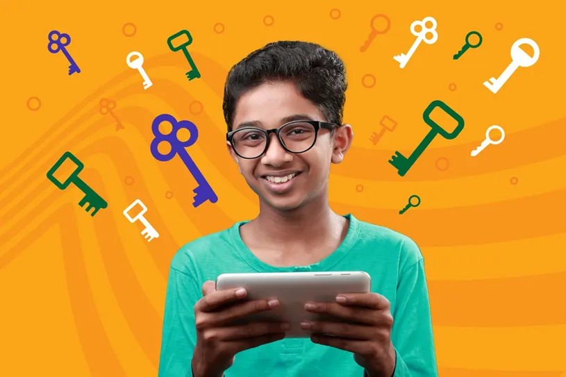 Boy holding a tablet and smiling